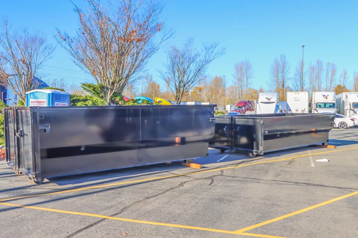 Professional dumpster rental service with roll-off container on residential driveway in James Island